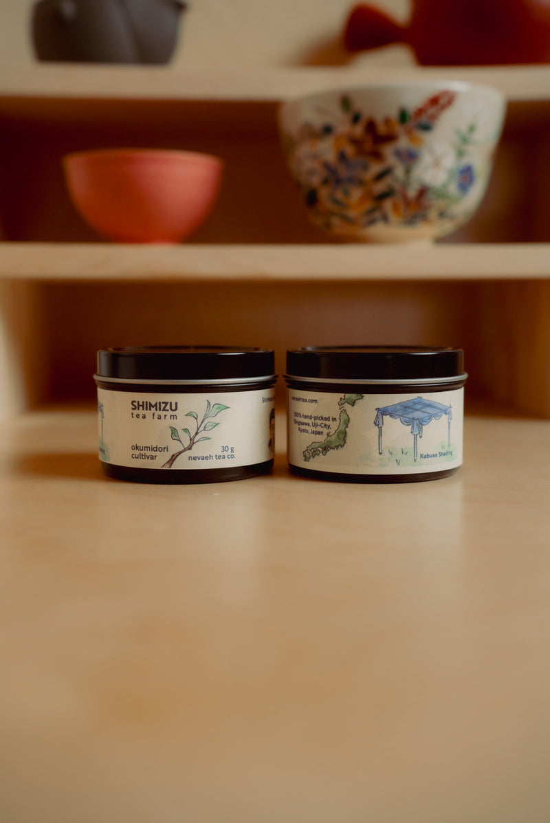 Two small containers with labels on a wooden surface with blurred background